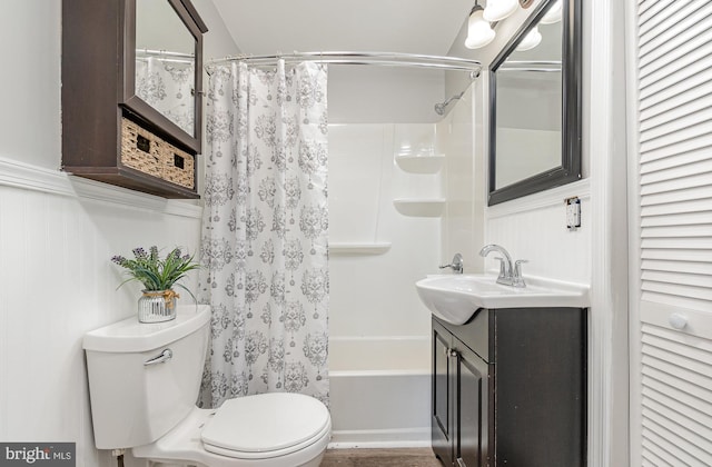 full bathroom featuring vanity, toilet, and shower / bathtub combination with curtain