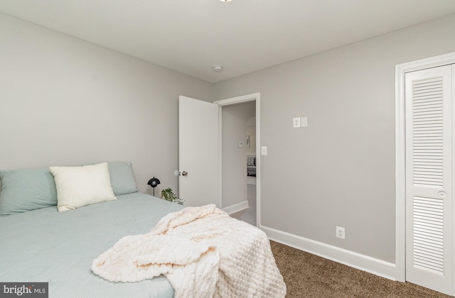 carpeted bedroom with a closet