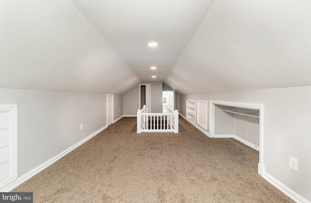 bonus room featuring carpet and lofted ceiling