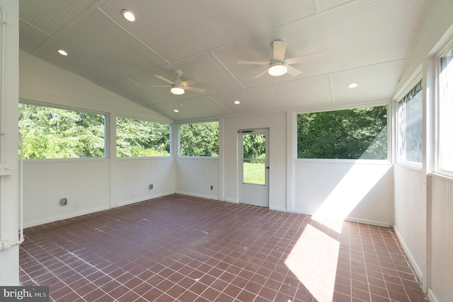 unfurnished sunroom with vaulted ceiling and ceiling fan