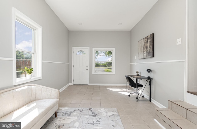 foyer featuring light tile patterned floors