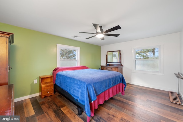 bedroom featuring ceiling fan and dark hardwood / wood-style floors