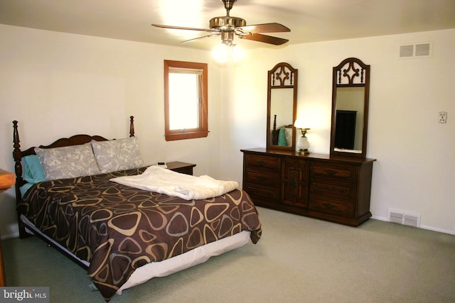 bedroom with ceiling fan and light colored carpet