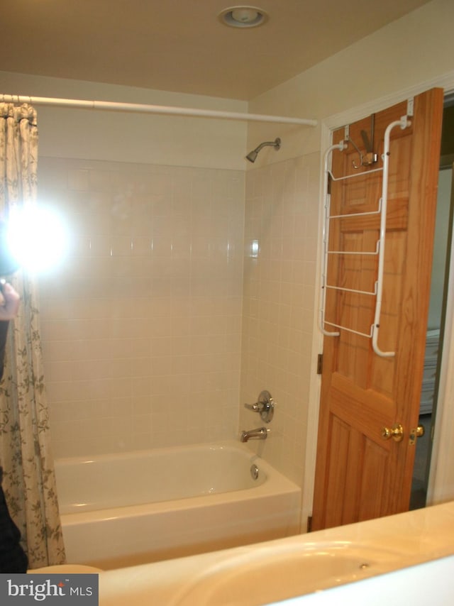 bathroom featuring shower / bath combination with curtain