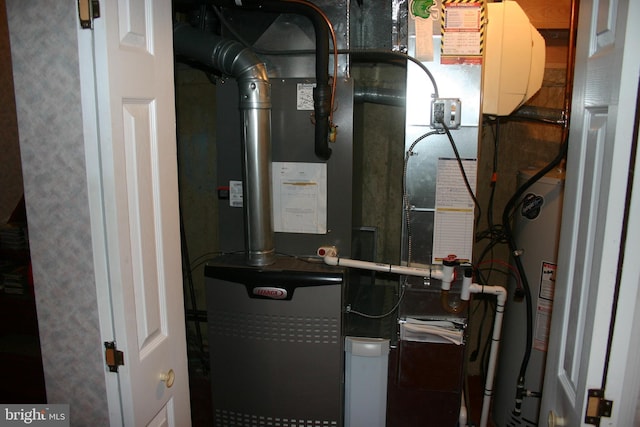 utility room featuring heating unit