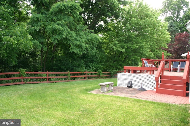 view of yard featuring a wooden deck