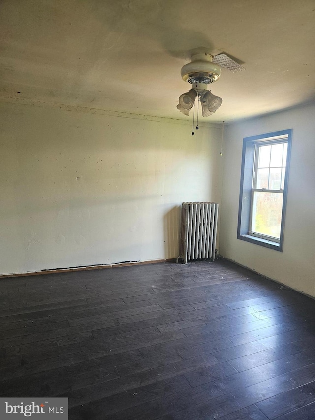 1740 N 3rd St, Philadelphia, PA 19122 - empty room featuring dark wood-type flooring, ceiling fan, and radiator