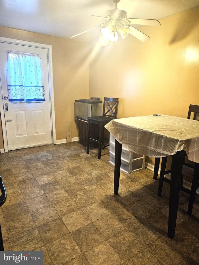 interior space featuring ceiling fan