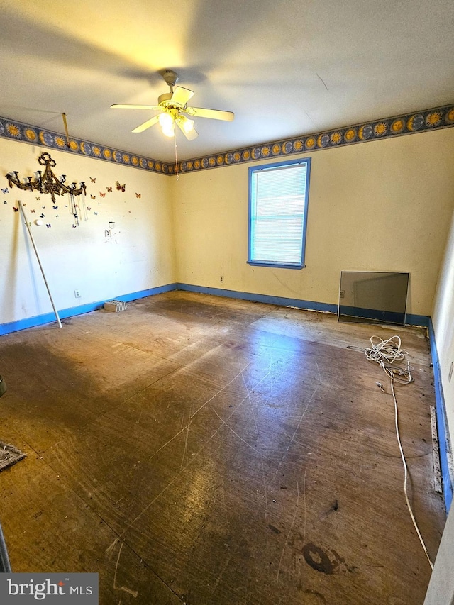 unfurnished room with ceiling fan