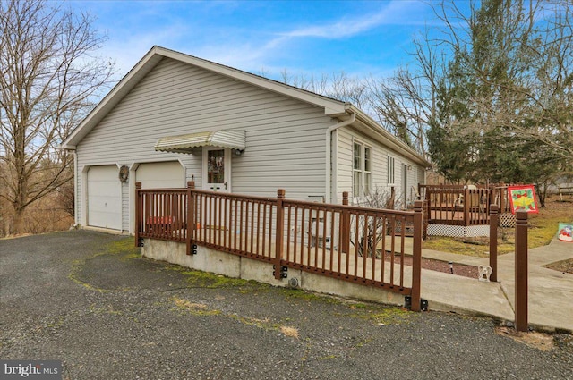 view of property exterior with a deck