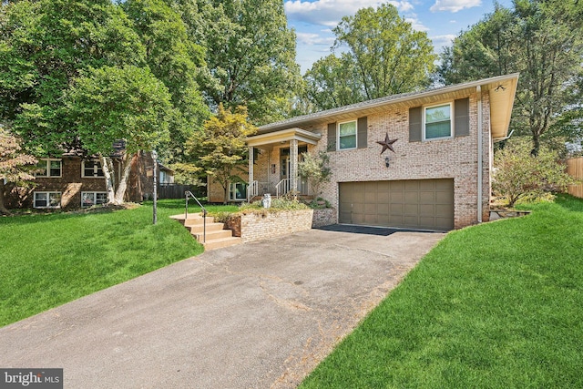 view of front facade with a garage and a front lawn