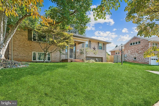 rear view of house featuring a yard