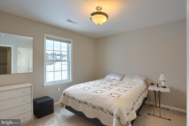 bedroom with light carpet