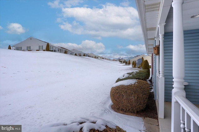 view of yard layered in snow