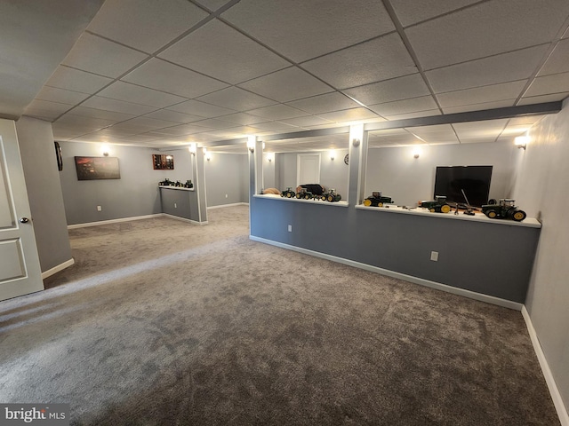 basement with a drop ceiling and carpet floors