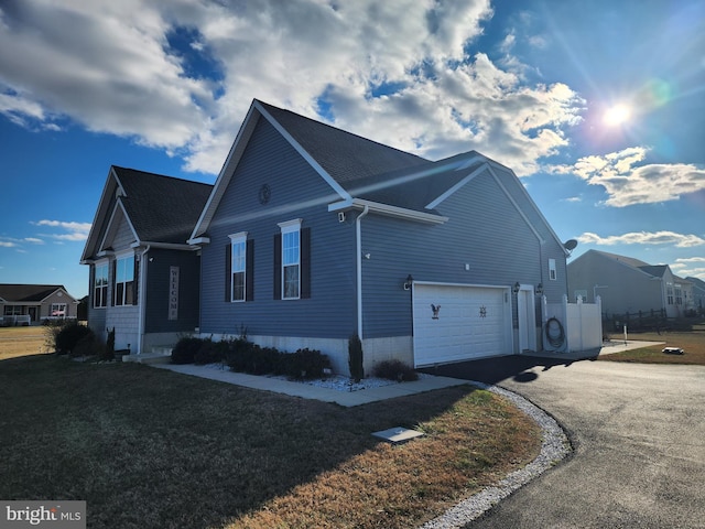 view of home's exterior with a garage