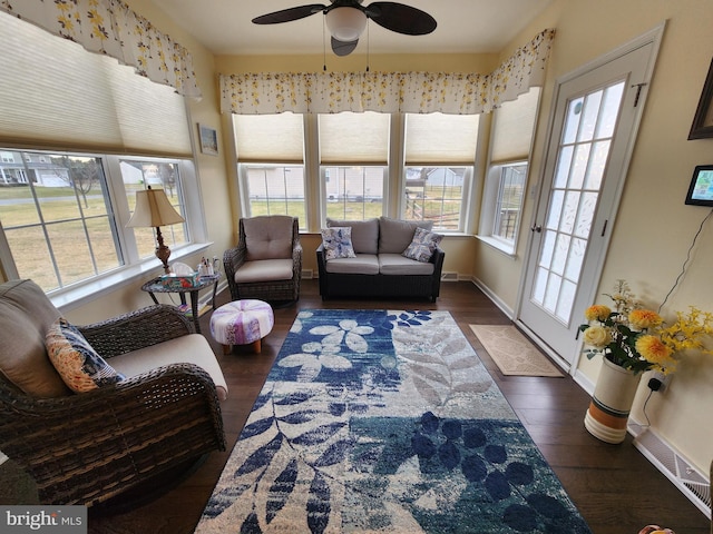 sunroom featuring ceiling fan and a healthy amount of sunlight