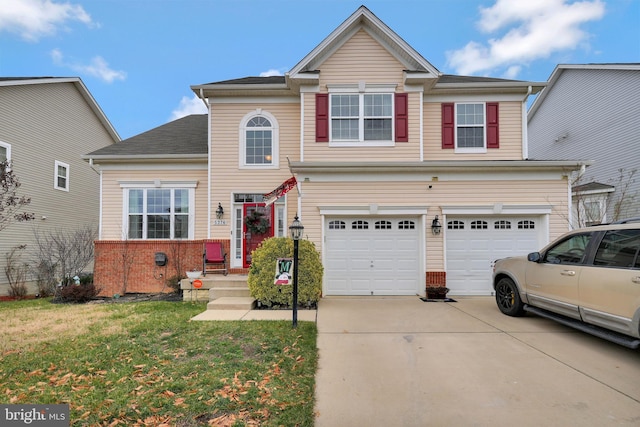 view of front of house with a garage and a front lawn