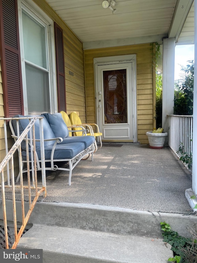 property entrance with a porch