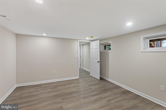 basement with wood-type flooring