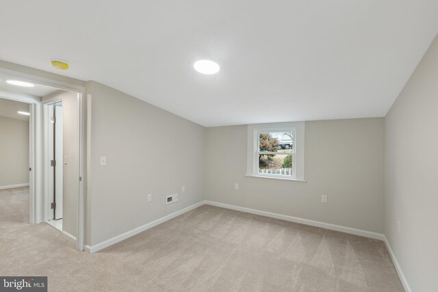 additional living space with light colored carpet