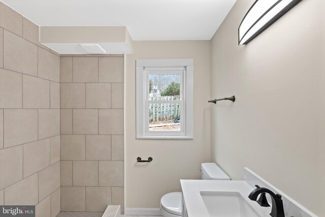 bathroom featuring sink and toilet