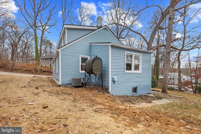 view of side of property with central AC unit