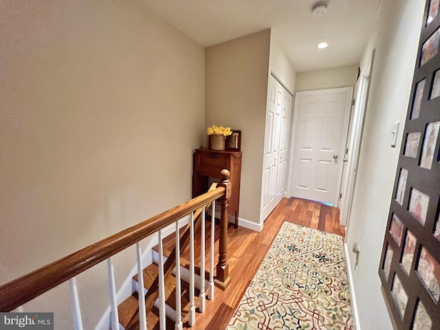 hall with light hardwood / wood-style floors