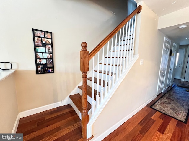 stairway with wood-type flooring