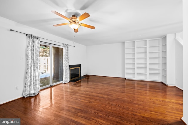 unfurnished living room with wood-type flooring and ceiling fan