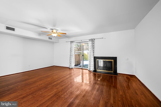 unfurnished living room featuring wood-type flooring and ceiling fan