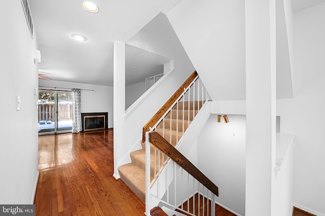 stairs with wood-type flooring