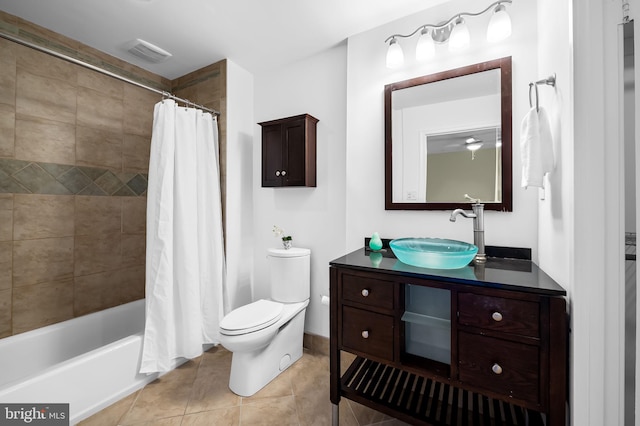 full bathroom featuring tile patterned floors, vanity, toilet, and shower / tub combo