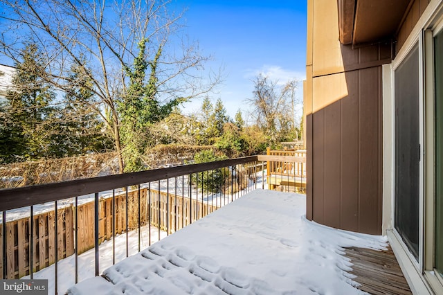 view of snow covered deck