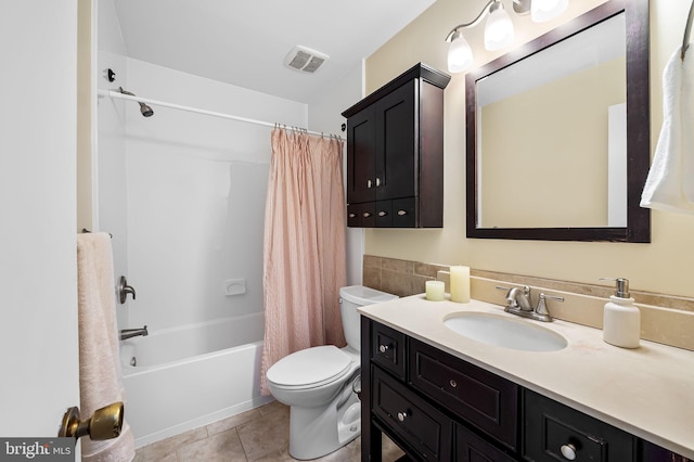 full bathroom with tile patterned floors, vanity, toilet, and shower / tub combo