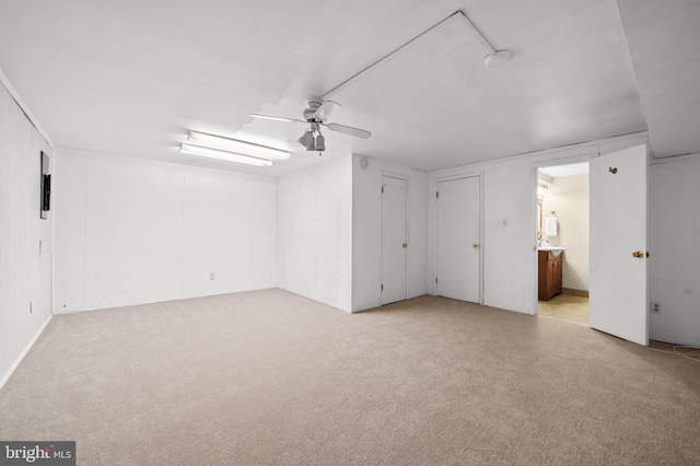 interior space with ceiling fan