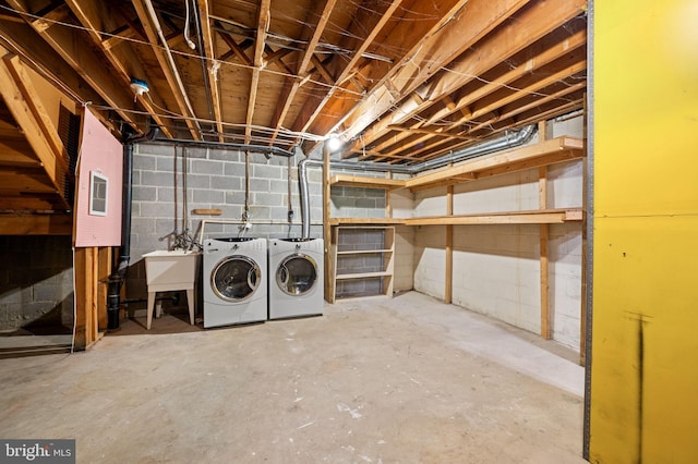 laundry area with washer and dryer and sink