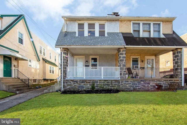 view of front of home with a porch and a front lawn