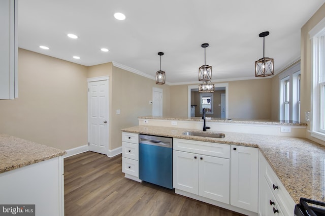 kitchen with light stone countertops, stainless steel dishwasher, sink, decorative light fixtures, and white cabinetry