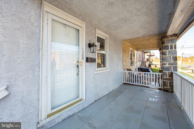 property entrance featuring covered porch