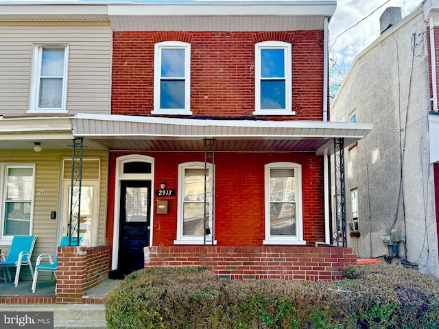 view of property with a porch