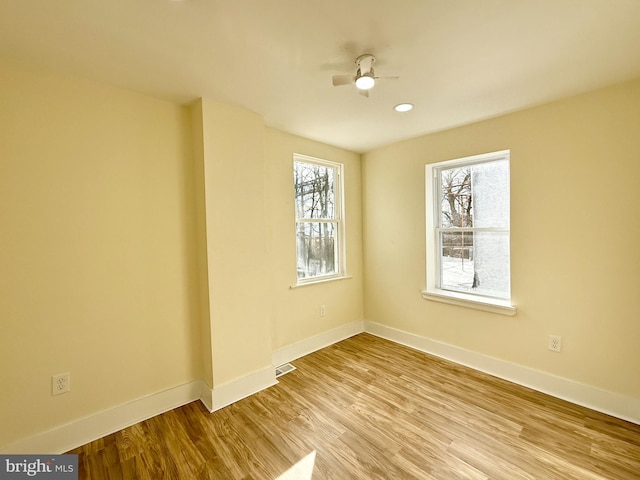 unfurnished room featuring ceiling fan and light hardwood / wood-style floors