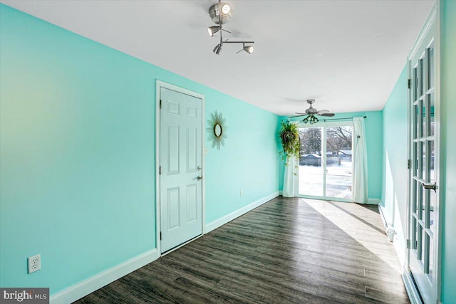 interior space with ceiling fan and wood-type flooring