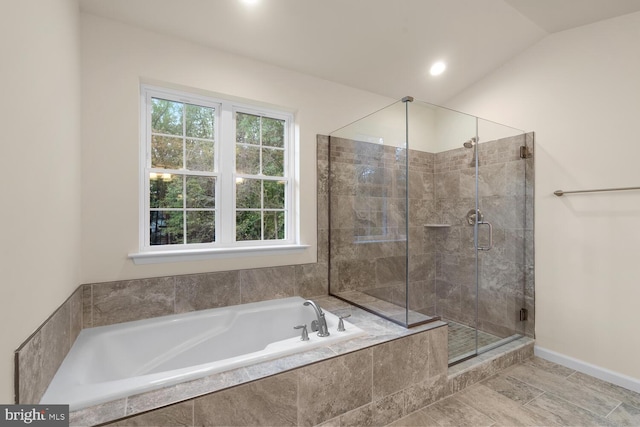 bathroom with plus walk in shower and lofted ceiling