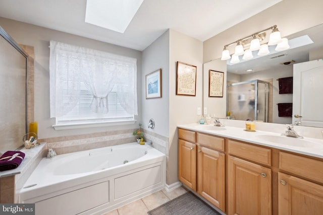 136 Sandpiper Ln, West Deptford, NJ 08086 - bathroom featuring tile patterned flooring, vanity, a skylight, and plus walk in shower
