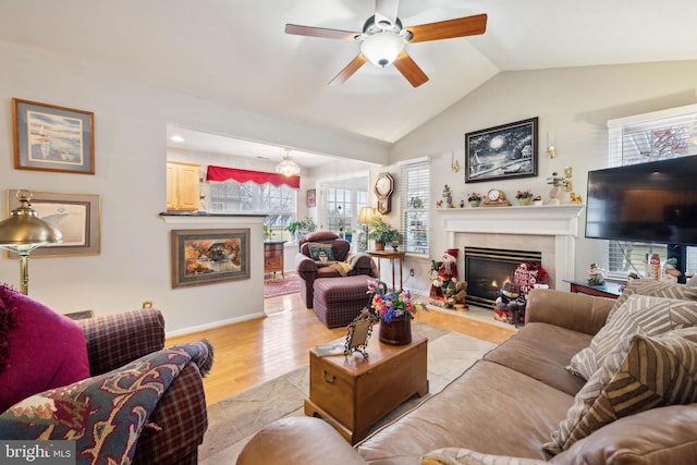 136 Sandpiper Ln, West Deptford, NJ 08086 - living room featuring vaulted ceiling, ceiling fan, a high end fireplace, and light hardwood / wood-style flooring
