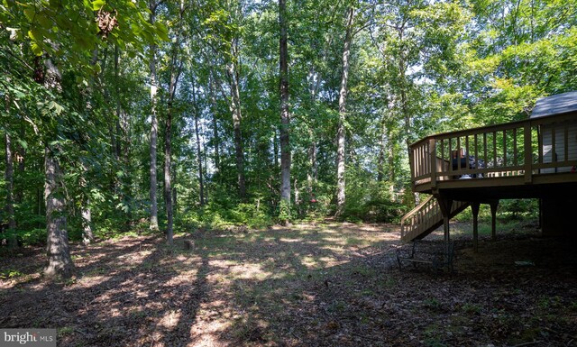 view of yard with a wooden deck