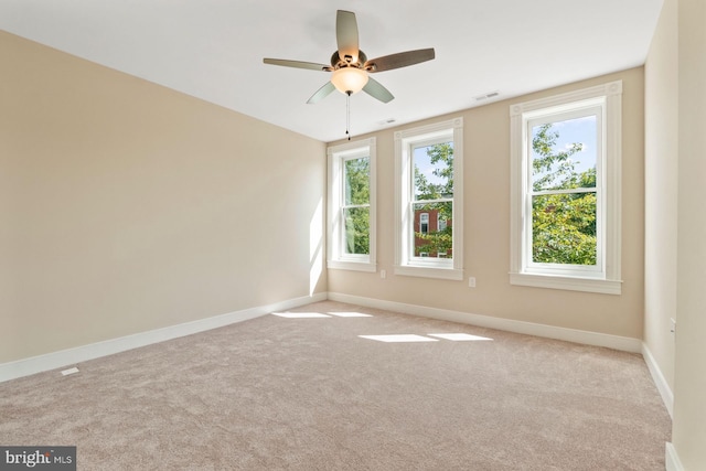 carpeted empty room with ceiling fan