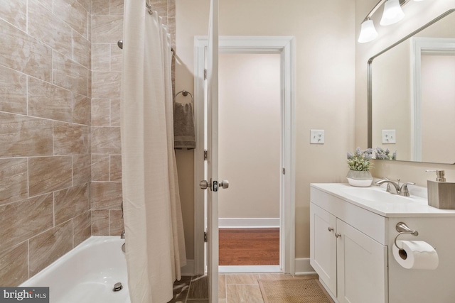 bathroom with tile patterned floors, shower / tub combo with curtain, and vanity