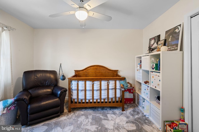 carpeted bedroom with ceiling fan